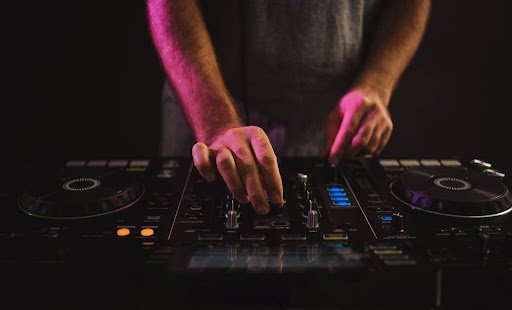 Professional DJ services in Darien, CT with a DJ mixing music on premium event equipment.
