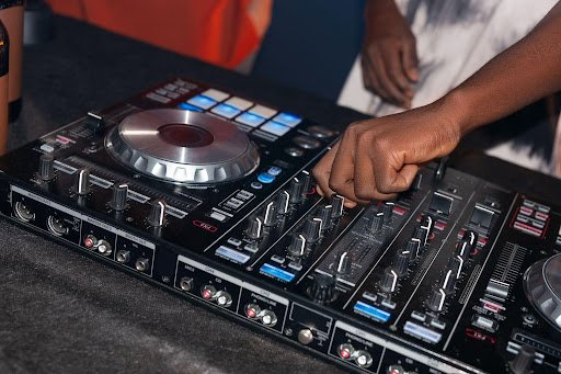 Professional DJ mixing music on a controller for DJ services in New Canaan, CT at weddings, parties, and special events.